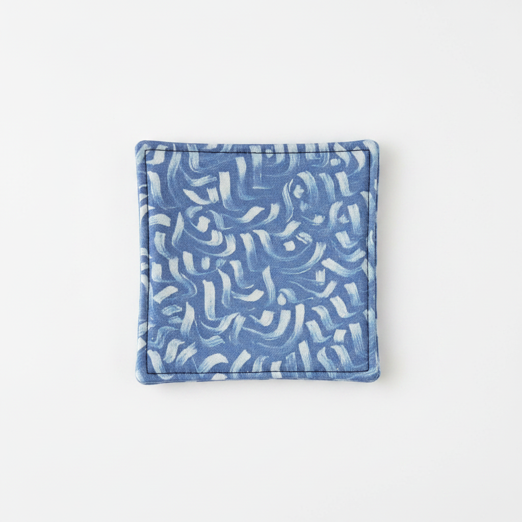 Dessous-de-verre tissé fait main bleu motifs abstraits
